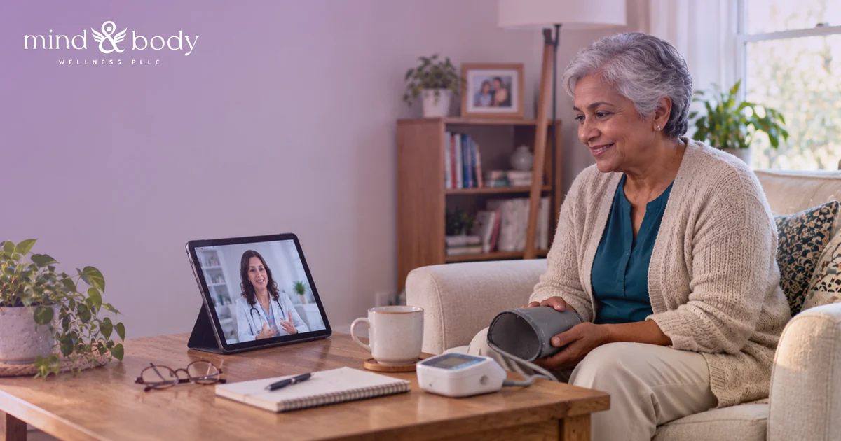 Older adult on a couch holding a blood pressure cuff during a telehealth video visit with a provider on a tablet