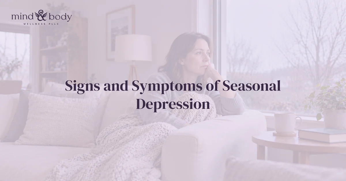 Person looking out a window on a gray winter day, representing the signs and symptoms of seasonal depression